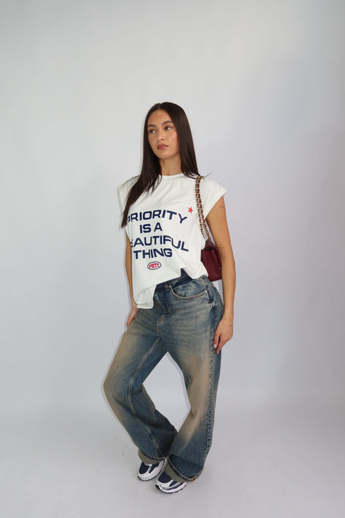 priority sleeveless tee white